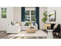 Bright living room with a modern white sofa, neutral rug, and large windows with stylish blue curtains at 1755 Barrett Run Trl # 213, Apex, NC 27502