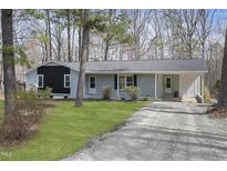 Charming one-story home with a mix of siding colors and a spacious driveway at 2312 Valley Rd, Sanford, NC 27330