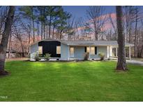 Charming single-story home with a well-maintained lawn and fresh exterior paint at 2312 Valley Rd, Sanford, NC 27330