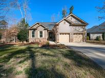 Charming single-Gathering home with attached two-car garage and professionally landscaped yard at 2813 Reynolda Cir, Durham, NC 27712