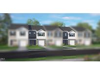 New townhome exterior with gray siding, white trim, and a one car garage at 42 Sweet Meadow Rd, Angier, NC 27501
