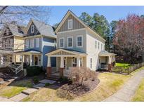 Charming two-story home with a welcoming front porch and manicured lawn at 4443 Crystal Breeze St, Raleigh, NC 27614
