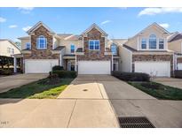 Charming townhomes with manicured lawns and attached garages, offering convenient and stylish living at 8008 Upper Lake Dr, Raleigh, NC 27615