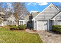 Charming home with a two-car garage, well-manicured lawn, and mature landscaping creates inviting curb appeal at 113 Duchess Ln, Chapel Hill, NC 27517
