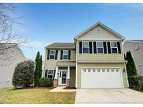 Charming two-story home featuring a two-car garage, well-maintained lawn, and welcoming entrance at 1501 Copper Cir, Mebane, NC 27302