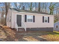 Charming single-story home featuring a stone foundation and traditional siding at 158 Torain St, Hillsborough, NC 27278