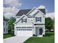 Charming two-story home features a two-car garage, light gray siding, and a well-manicured lawn at 251 Meadowbark Bnd # 30, Garner, NC 27529