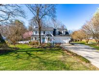 Charming two-story home with attached garage and well-manicured front lawn at 604 Trunecek Cir, Raleigh, NC 27603