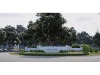A serene entrance to Cattail is marked by lush landscaping and a welcoming sign at 74 Alex Farm Ct # 22, Zebulon, NC 27597