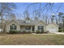 Charming single-story home with a welcoming front porch and well-maintained landscaping at 1013 Minnie Dr, Raleigh, NC 27603