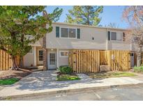 Charming townhouse with a fenced-in front yard and well-maintained landscaping offers curb appeal at 220 Elizabeth St # B5, Chapel Hill, NC 27514
