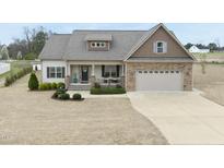 Beautiful single Gathering home with a well manicured lawn and 2 car garage at 73 Vibernum Vw, Four Oaks, NC 27524