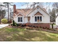 Charming two-story home with a brick foundation, landscaped yard, and inviting curb appeal at 628 Woods Mill Cir, Wake Forest, NC 27587
