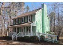 Charming two-story home with a welcoming front porch and ramp access at 6312 Guess Rd, Durham, NC 27712