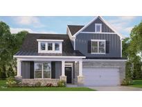 Charming two-story home with gray siding, stone accents, covered front porch and attached two car garage at 7553 Percussion Dr, Apex, NC 27539