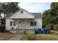 Quaint one-story home with a covered front porch and classic charm at 1005 N Wilson Ave, Dunn, NC 28334