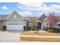 Charming home with a two-car garage and well-manicured landscaping at 1214 Gaston Manor Dr, Durham, NC 27703