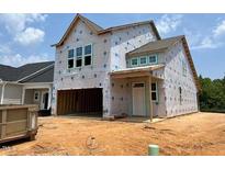 Exterior of home under construction featuring large windows and attached garage at 239 Meadowbark Bnd # 27, Garner, NC 27529