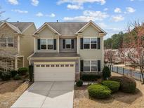 Charming two-story home with a two-car garage and manicured front yard landscaping at 241 Westgrove Ct, Durham, NC 27703
