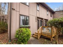 Inviting townhome featuring a charming front porch and well-maintained landscaping at 3080 Colony Rd # A, Durham, NC 27705
