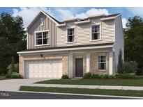 Charming two-story home featuring a brick and siding facade and an attached garage at 73 Club Rd, Louisburg, NC 27549