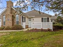 Charming home featuring a brick chimney and inviting white picket fence enhancing its curb appeal at 1146 Blue Bird Ln, Wake Forest, NC 27587