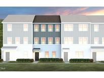 Charming new construction townhomes feature modern design, green landscaping, and welcoming front entrances at 1485 Hasse Ave, Apex, NC 27502