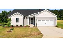 Charming single-story home with gray siding, a well-manicured lawn, and an attached two-car garage at 207 Golfview Ave, Benson, NC 27504