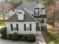 Charming two-story home showcasing a well-manicured lawn and inviting entrance at 2760 Clifton Ave, Creedmoor, NC 27522