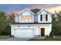 Two-story home with white siding, a brown roof, a two-car garage and a professionally landscaped yard at 2915 Huxley Way, Apex, NC 27502