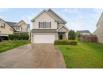 Charming two-story home with a two car garage and well-maintained landscaping at 4038 Patriot Ridge Ct, Raleigh, NC 27610