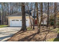 Charming home featuring an attached two-car garage and mature trees at 4207 Hulon Dr, Durham, NC 27705