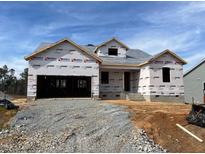 New construction home featuring a two-car garage and architectural roof shingles, ready for customization and design at 47 Tee Time Ter, Benson, NC 27504