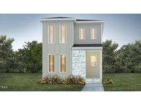 Modern two-story home featuring large windows, stone accents, and manicured landscaping, creating an inviting curb appeal at 107 Parkland Dr, Pittsboro, NC 27312