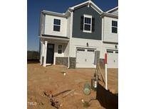 New construction townhome with white siding, gray accents, and a one-car garage at 30 Twin Birch Dr, Angier, NC 27501