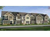 New construction townhome showing covered entry, sidewalk, grass, and various shades of siding at 6401 Granite Quarry Dr, Raleigh, NC 27610