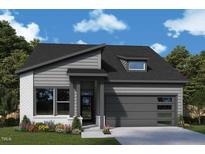 Charming single-story home featuring a modern design, gray siding, brick accents, and a well-manicured front yard at 75 Wabash St, Pittsboro, NC 27312