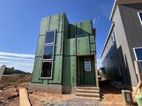 New construction with modern design featuring large windows and ZIP system sheathing at 95 Parkland Dr, Pittsboro, NC 27312