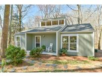 Charming single-story home featuring a welcoming front porch and beautiful natural surroundings at 100 Briar Patch Ln, Chapel Hill, NC 27516