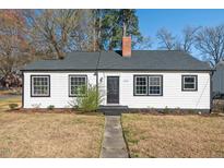 Charming single-story home features a classic design with a well-manicured lawn and inviting entrance at 2524 Banner St, Durham, NC 27704