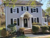 Charming two-story home with gray siding, black shutters, and a covered front porch at 3616 Open Sight Ct, Raleigh, NC 27616