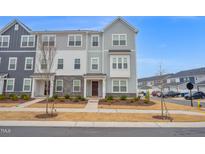 Charming townhome with stone accents and a well-manicured front yard at 5813 Empathy Ln, Raleigh, NC 27616