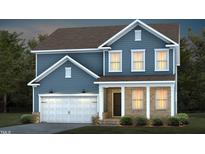Charming two-story home featuring a blue exterior, brick accents, well-lit windows, and an attached two-car garage at 521 Fosterton Cottage Way, Raleigh, NC 27603