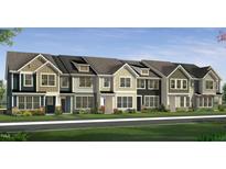 Charming row of townhomes featuring varied siding, manicured landscaping, and welcoming entryways at 6409 Granite Quarry Dr, Raleigh, NC 27610