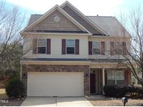 Charming two-story home with stone accents, a two car garage, and manicured landscaping at 78 Florence Dr, Clayton, NC 27527
