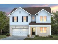 Charming two-story home boasts brick and siding exterior, complemented by a well-manicured lawn and inviting front entrance at 340 Bridle Brook Way, Fuquay Varina, NC 27526