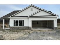 Charming single-Gathering home showcasing stone accents, neutral siding, and a spacious two-car garage at 380 Pecan Valley Way, Four Oaks, NC 27524