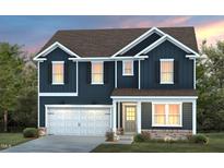 Charming two-story home with dark blue siding, a two-car garage, and manicured front lawn at 408 Providence Spring Ln, Fuquay Varina, NC 27526