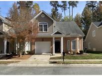 Charming two-story home features a brick facade, attached garage, and well-maintained landscaping at 6002 River Estates Dr, Knightdale, NC 27545
