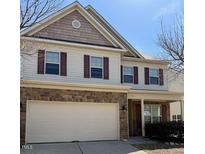 Charming two-story home featuring brick accents, vinyl siding and a two car garage at 78 Florence Dr, Clayton, NC 27527